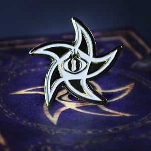 The Astral Elder Sign gold collectible pin with white enamel