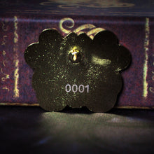 Back of collectible gold cthulhu pin