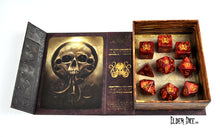The Brand of Cthulhu polyhedral dice set pictured inside the spellbook box