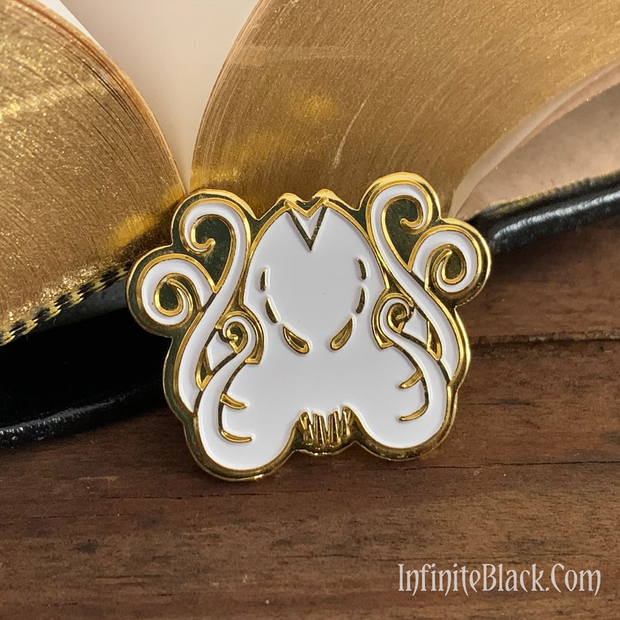 Gold and white Brand of Cthulhu enamel pin